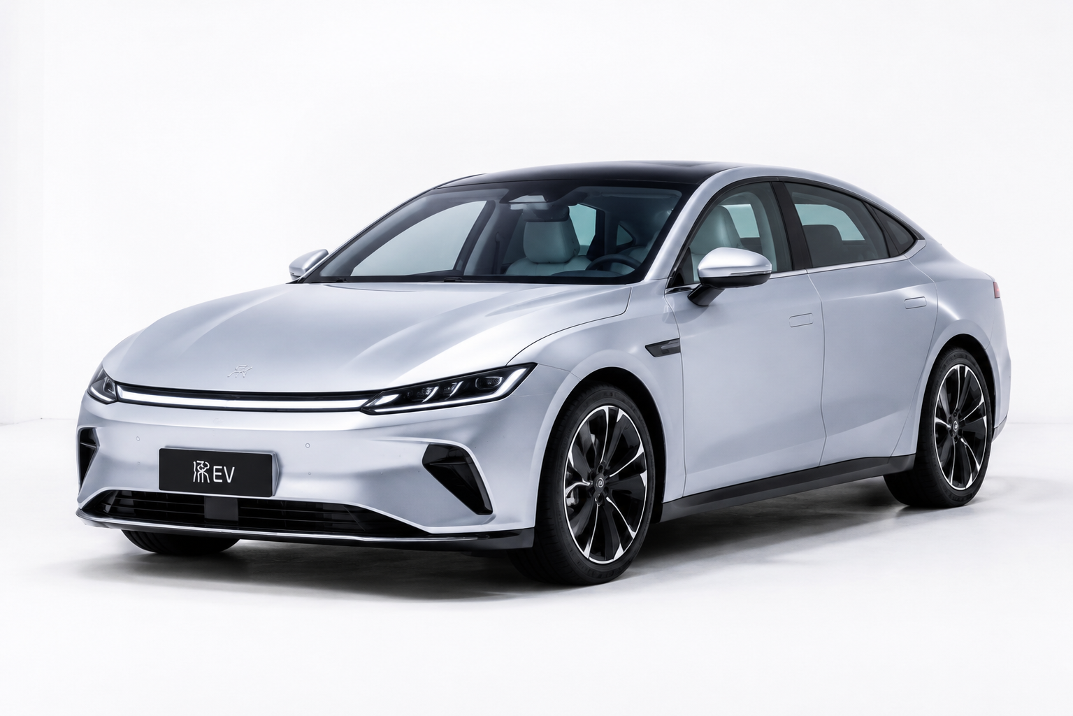 Silver electric sedan, studio three-quarter front angle